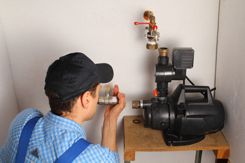Technician repairing a residential well pump in Portage County, OH