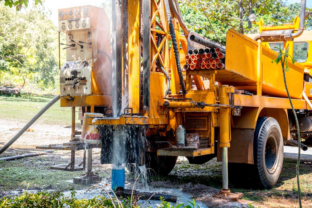 Well drilling rig boring a new water well on a rural property in Portage County, Ohio